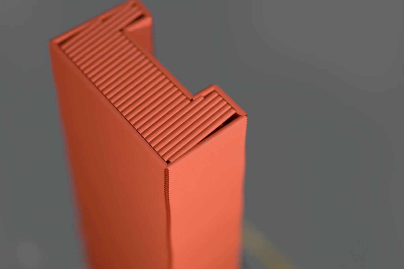 Extreme close-up of a printed tower's top corner, individual layer lines and the ridged top surface clearly visible against a soft grey background.
